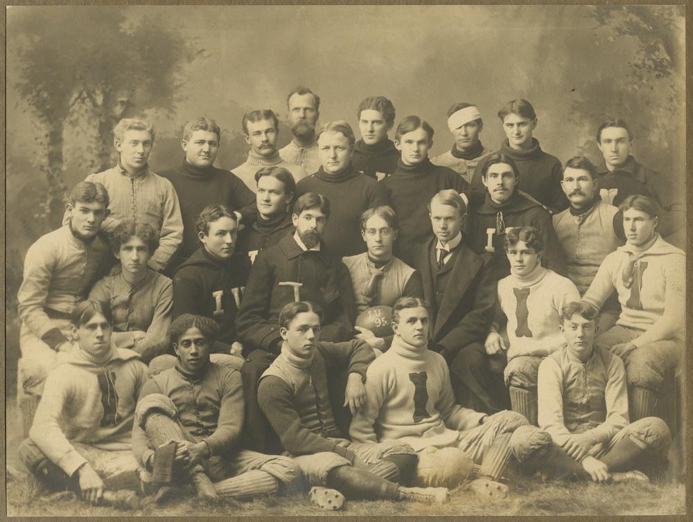 Sepia toned group studio photo of IU football team.